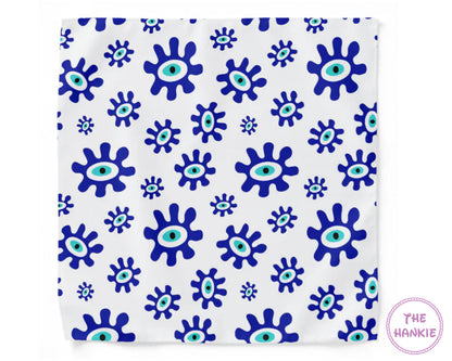 White hankie with blue and green eye pattern, branded 'The Hankie'.
