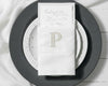 Embroidered cotton napkin with classic P monogram used as elegant table napkin holder