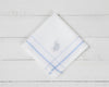 A set of three white U.S. Polo Assn. cotton handkerchiefs with navy, light blue, and red striped borders and embroidered logos.