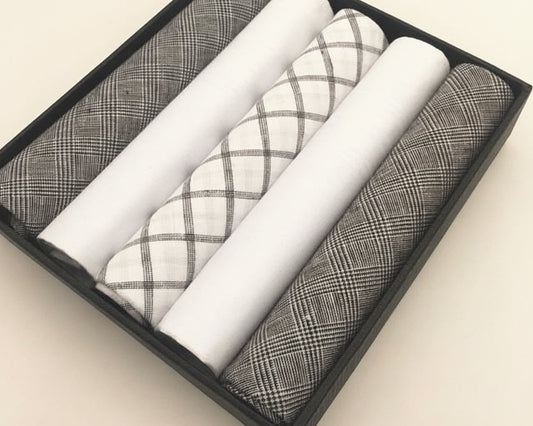 Overhead view of a professional gray series handkerchief collection showcasing various geometric cotton weaves.