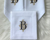 intage-style white cotton handkerchief with colorful floral embroidery and a delicate white lace border