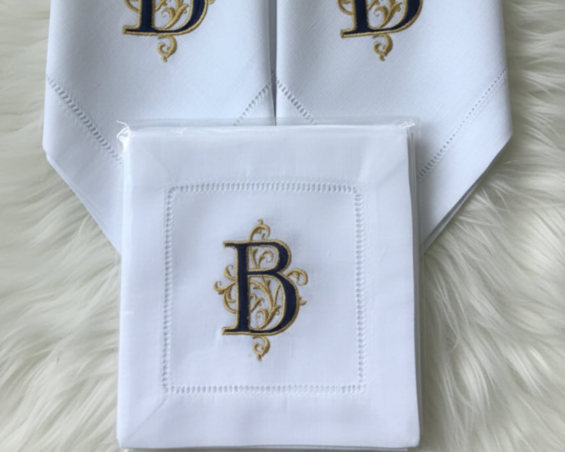 intage-style white cotton handkerchief with colorful floral embroidery and a delicate white lace border