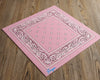 An angled view of a soft pink paisley handkerchief featuring "Freya" embroidered in a blue chain stitch font.