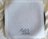 White handkerchief with 'Robert & Alma' embroidery on a white background