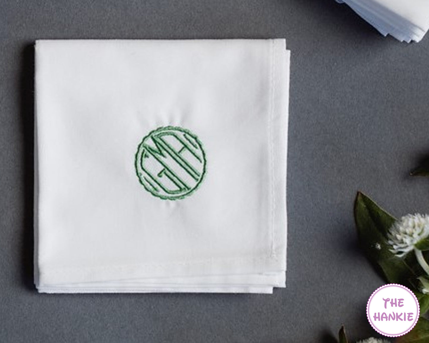 Personalized white handkerchief with green round monogram embroidery for wedding favors