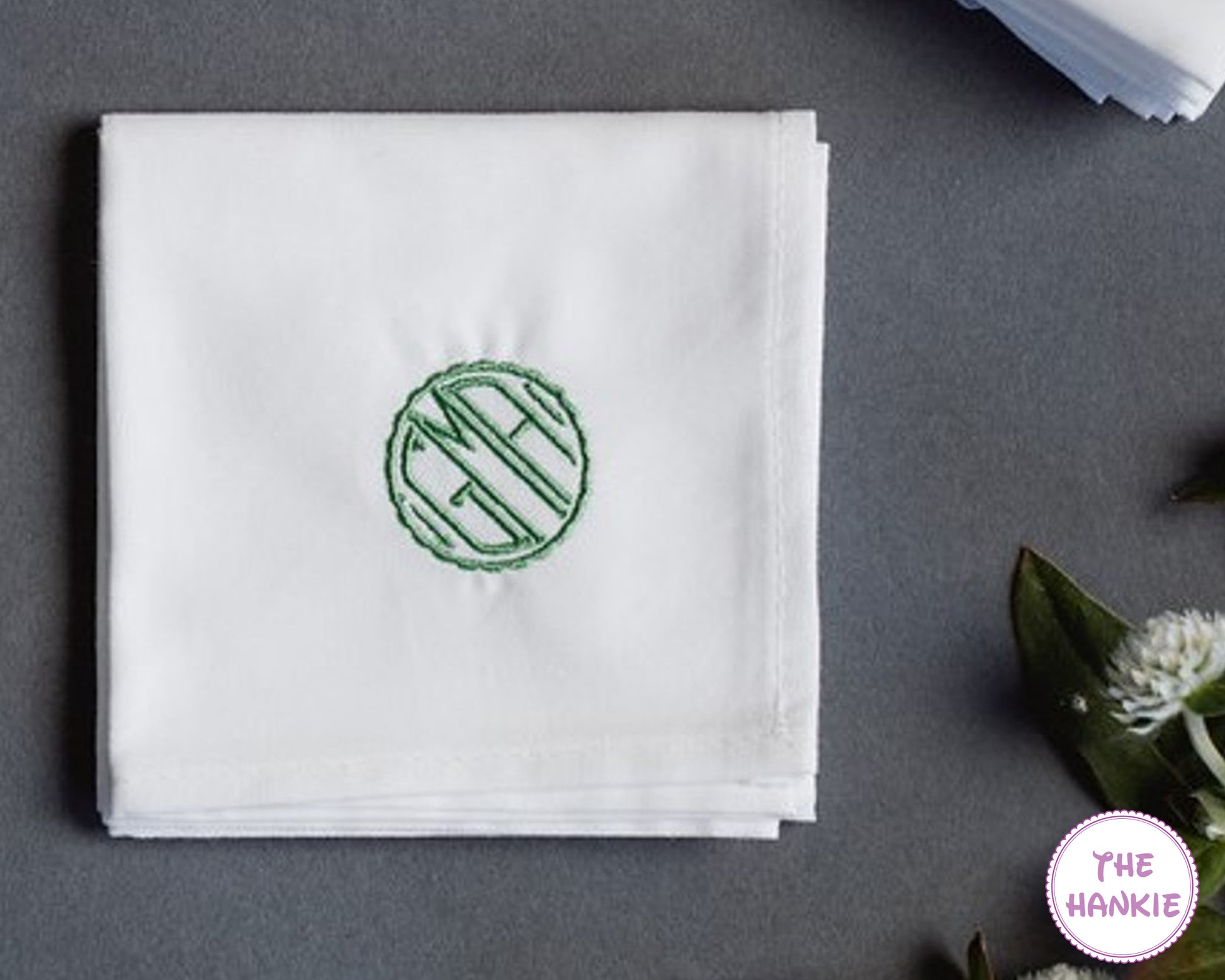 Personalized white handkerchief with green round monogram embroidery for wedding favors