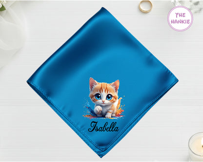 A radiant blue high-lustre satin pocket square customized with "Isabella" and a high-definition vinyl print of a cute ginger and white kitten.