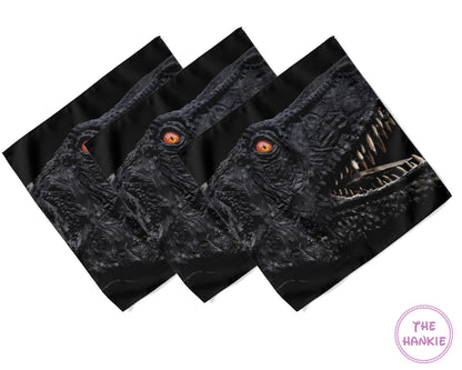 Set of three black hankies with dragon design on a white background