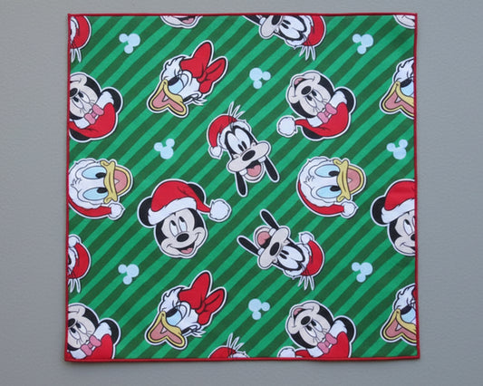 Single kids’ silky satin handkerchief featuring festive Mickey Mouse and friends on a green striped background.