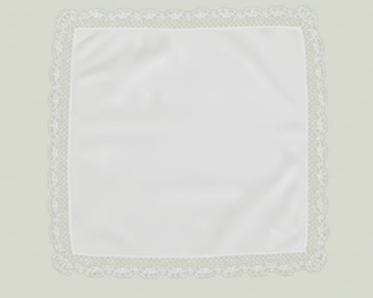 Close up detail of a white cotton handkerchief featuring a delicate geometric lace trim border.