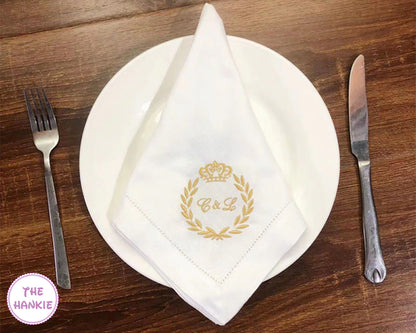 Luxury personalized wedding handkerchief with gold embroidered monogram on dinner plate