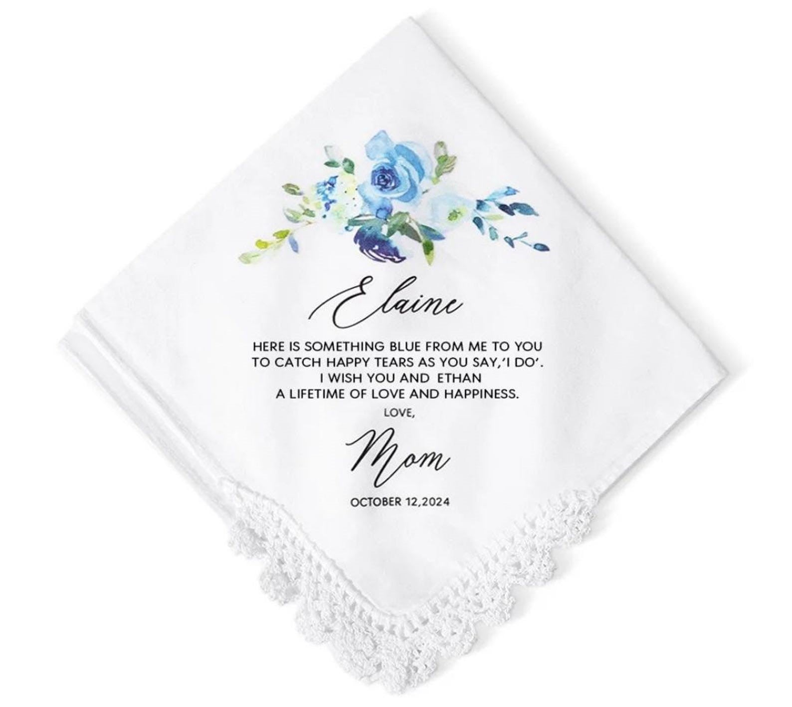 White handkerchief with floral design and personalized text on a white background