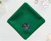 A lush forest green cotton handkerchief customized with "Mateo" below a mystical indigo and gold twin fish Pisces design.