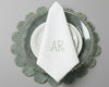 Personalized white dinner napkin with a minimalist sage green 'AR' monogram and hemstitch border detail