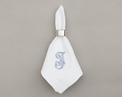 Monogrammed linen napkin with decorative napkin ring for luxury table décor
