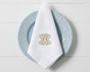 Monogrammed white linen napkin with embroidered initials for wedding and event table decor
