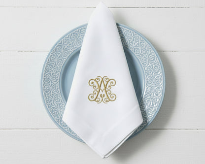 Monogrammed white linen napkin with embroidered initials for wedding and event table decor