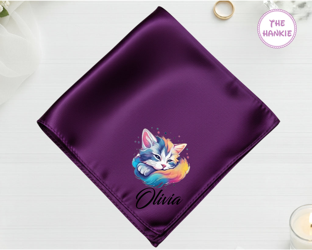 A deep amethyst purple luxury satin handkerchief personalized with the name "Olivia" below a vibrant, multi-colored sleeping kitten print.