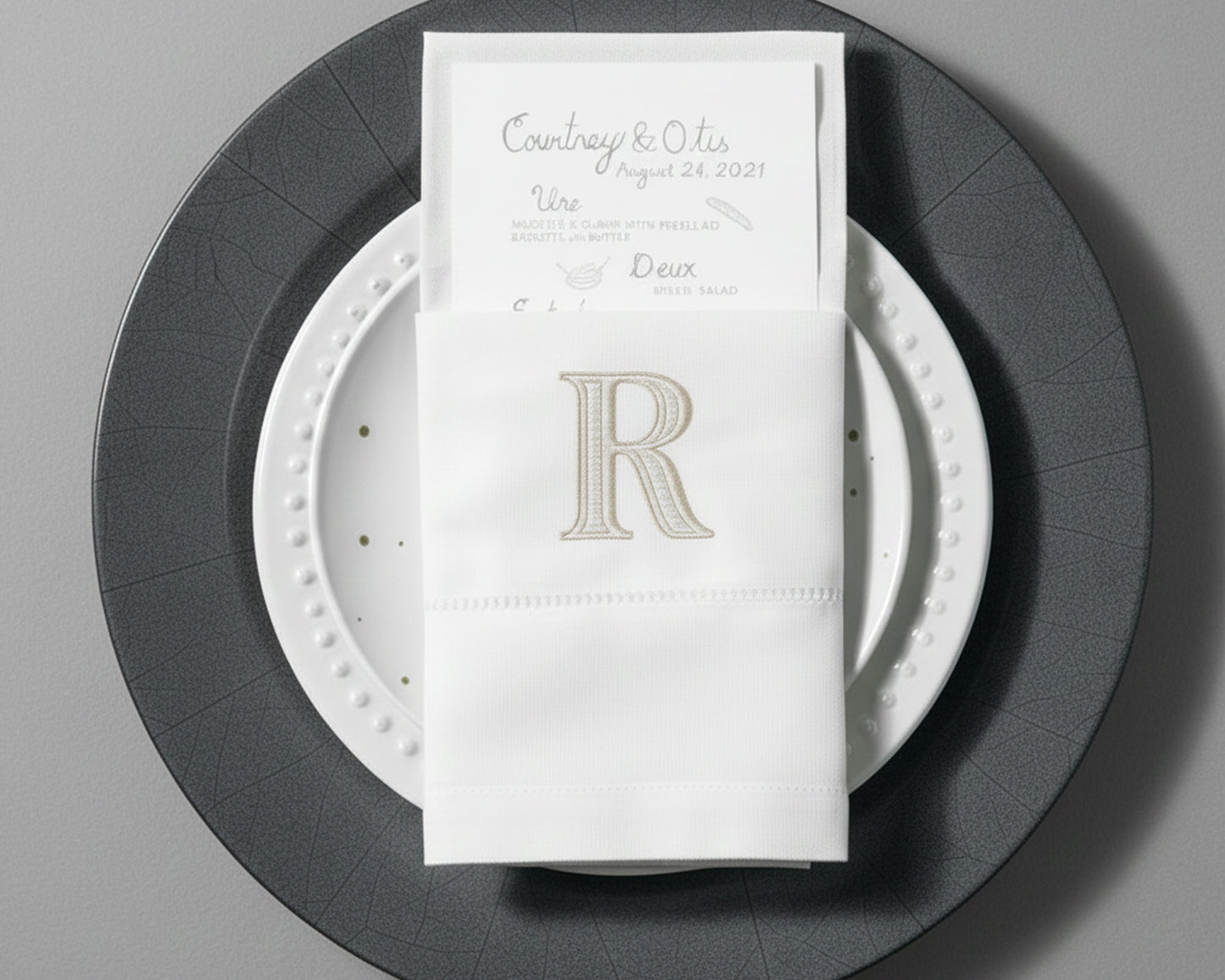 Personalized embroidered cotton napkin featuring classic R monogram for wedding table décor