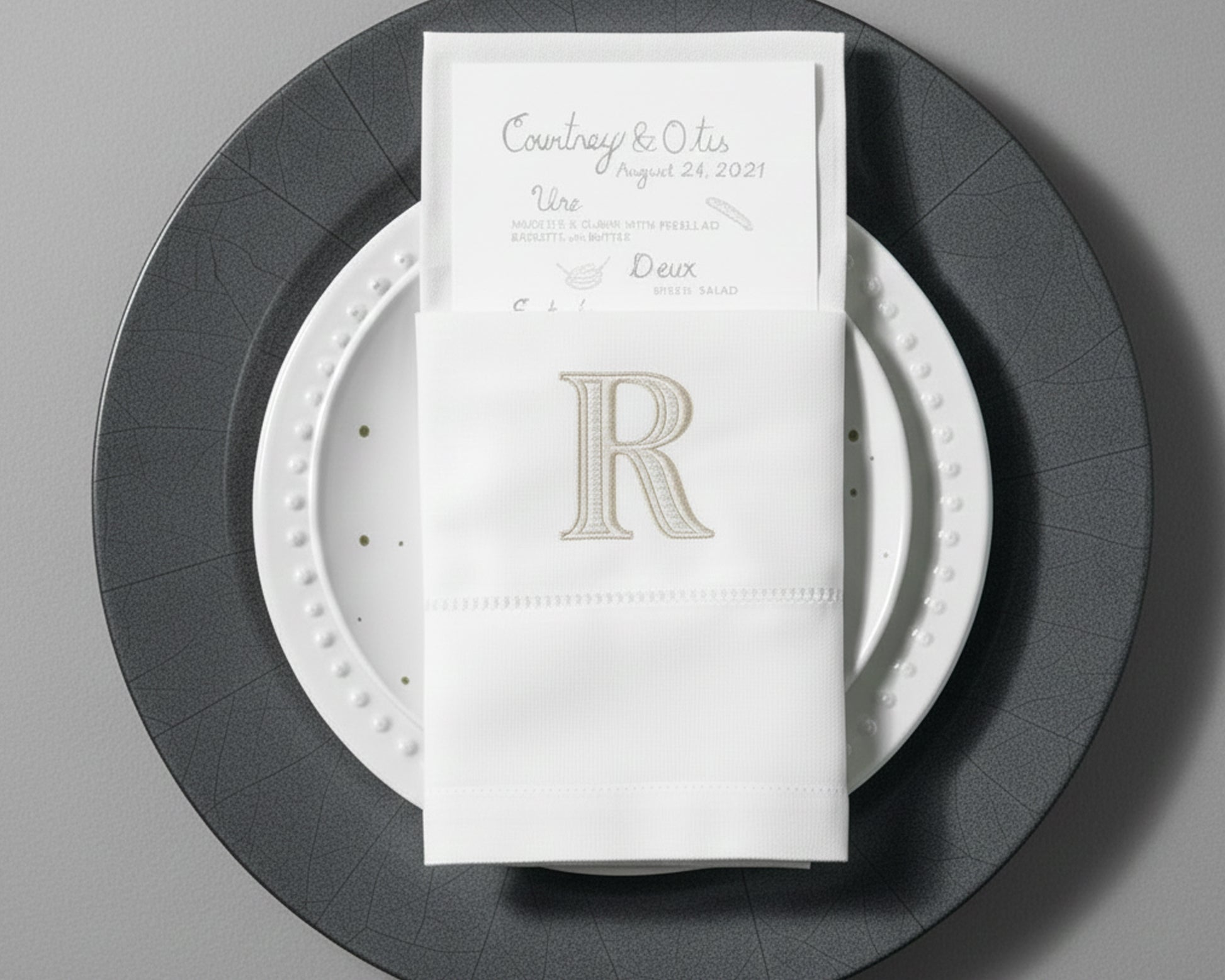 Personalized embroidered cotton napkin featuring classic R monogram for wedding table décor