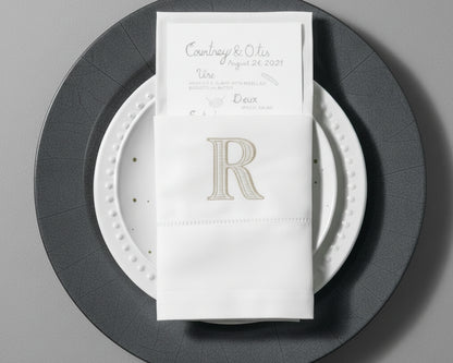 Personalized embroidered cotton napkin featuring classic R monogram for wedding table décor