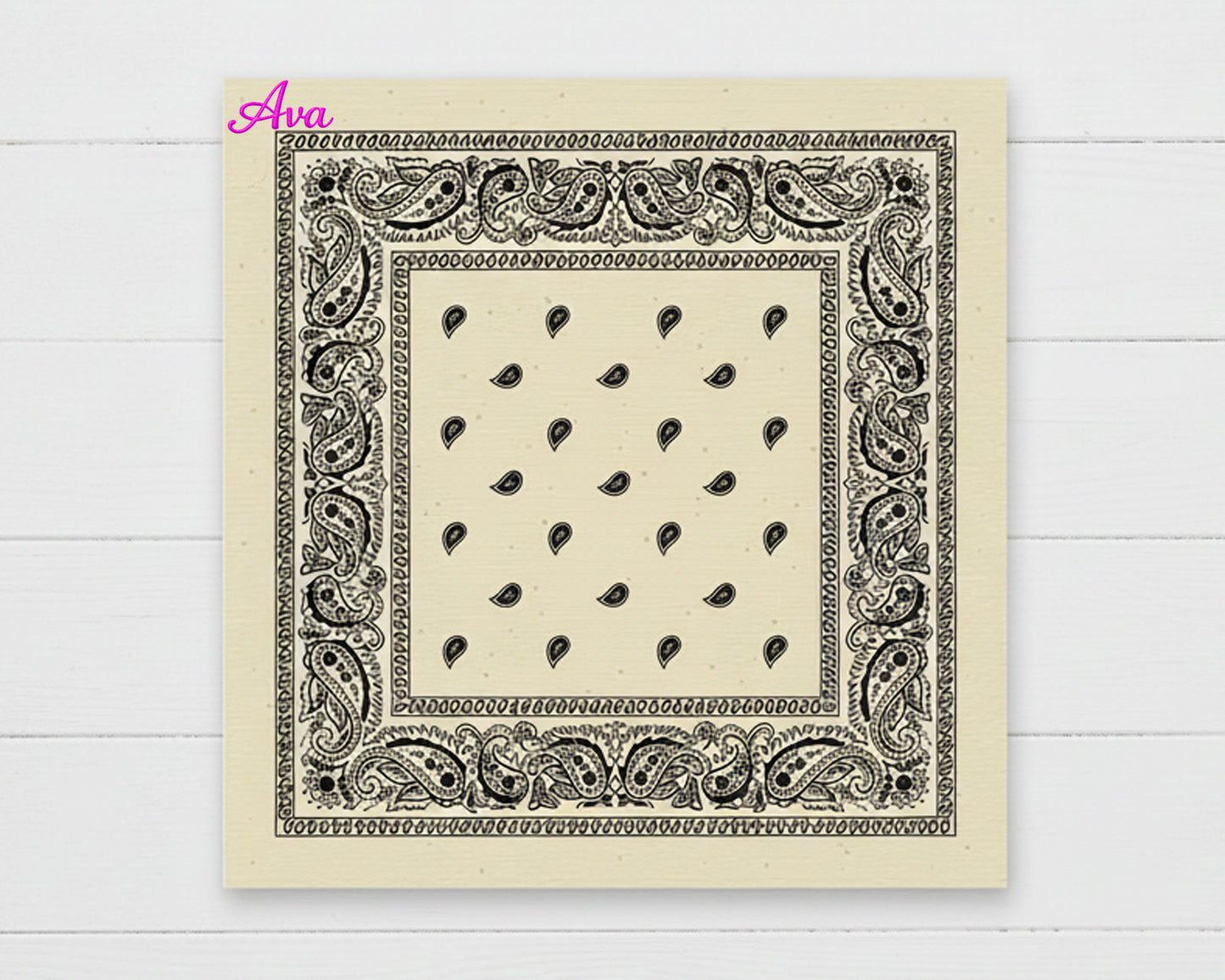 A cream-colored cotton paisley bandana with the name "Ava" personalized in a vibrant pink chain stitch script in the corner.