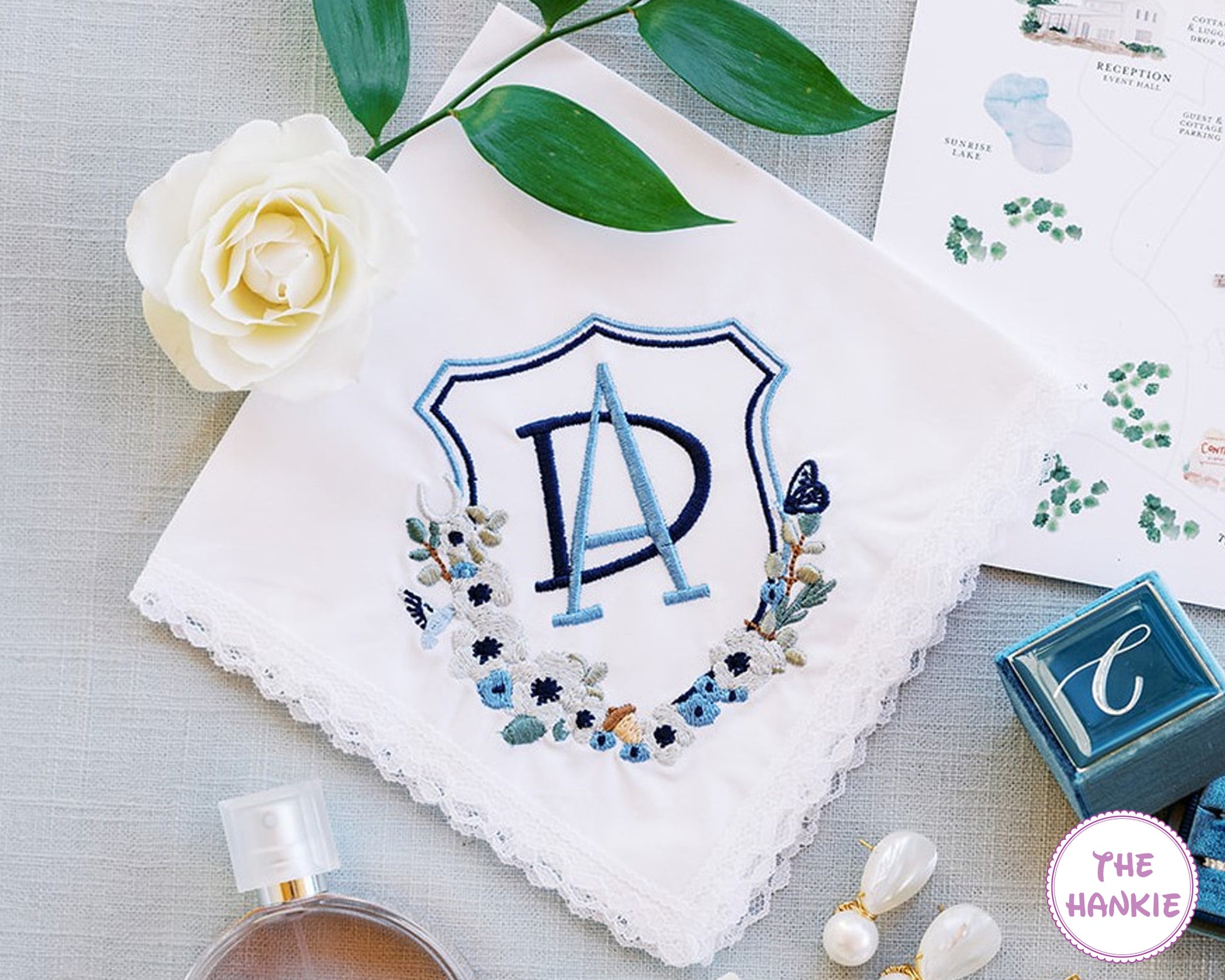 Personalized wedding handkerchief with blue embroidered initials and floral design