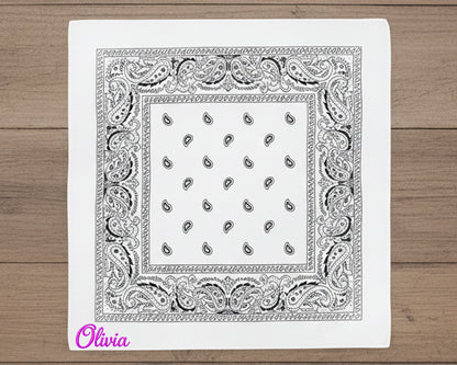 A stack of earth-toned western handkerchiefs in sage green, tan, and forest green with various custom names in chain stitch.