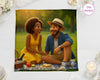 Illustration of a couple sitting on a blanket with food, surrounded by decorative items.