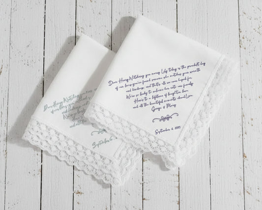 White cotton dinner napkin with an elegant sage green embroidered bow and personalized serif monogram