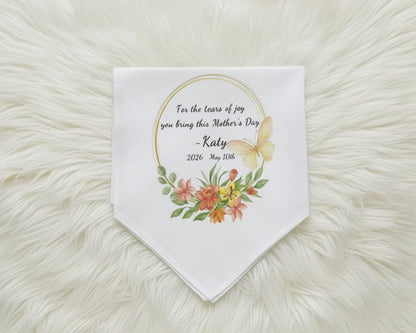 White bridal handkerchief with blue floral embroidery and a vintage-style lace border