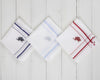 A crisp white U.S. Polo Assn. cotton pocket square featuring green striped borders and a red embroidered horseman logo.