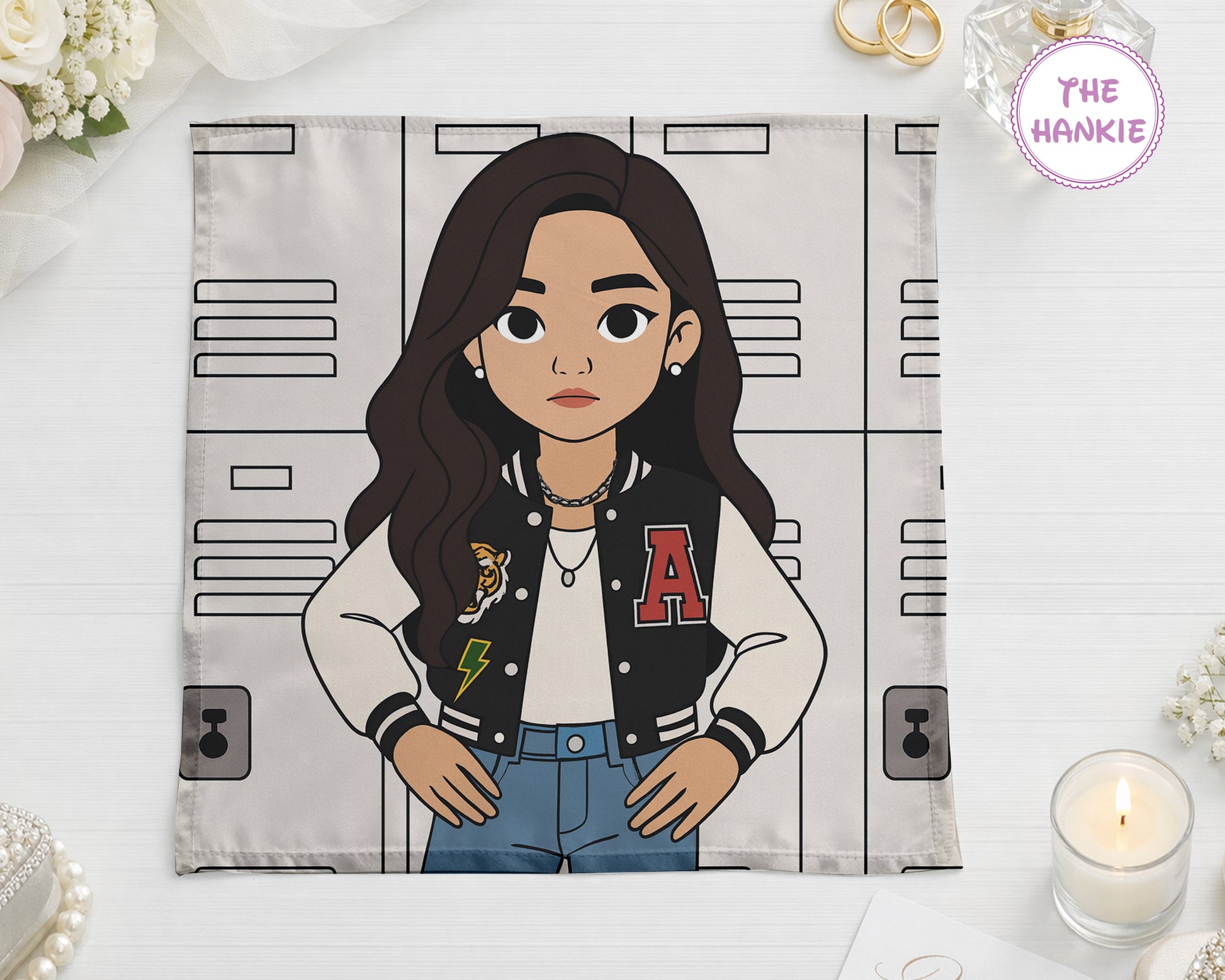 Illustrated character on a towel with locker design, featuring 'The Hankie' brand.