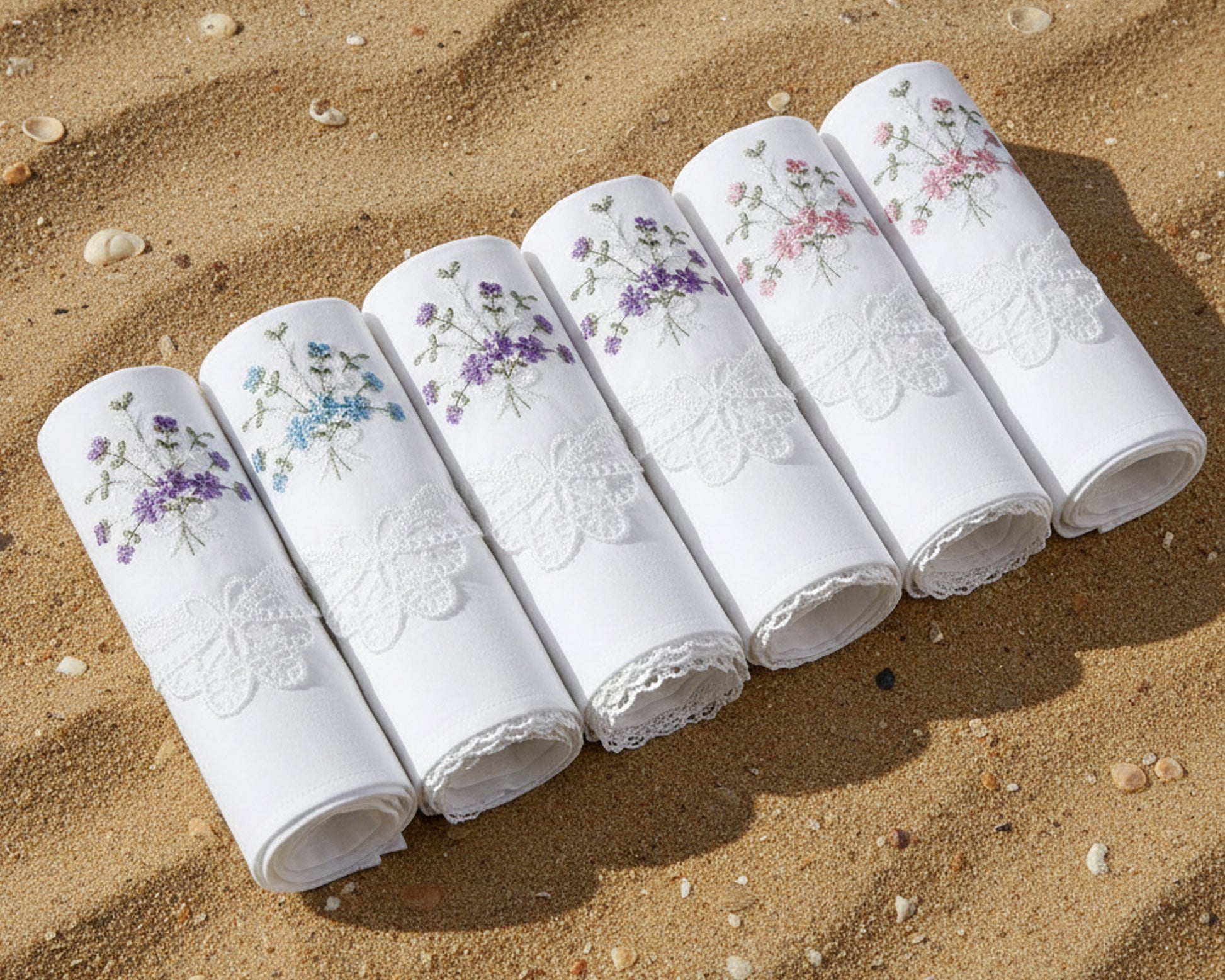 White cotton handkerchief with colorful floral embroidery and lace trim