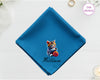 A sapphire blue cotton pocket square featuring the name "William" and a detailed digital print of a multi-colored kitten playing with a ball of yarn.